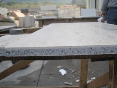Natural stone laminated with granite and fiberglass ()